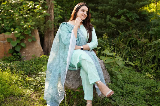 Woman wearing restyled lawn suit after Eid 2026